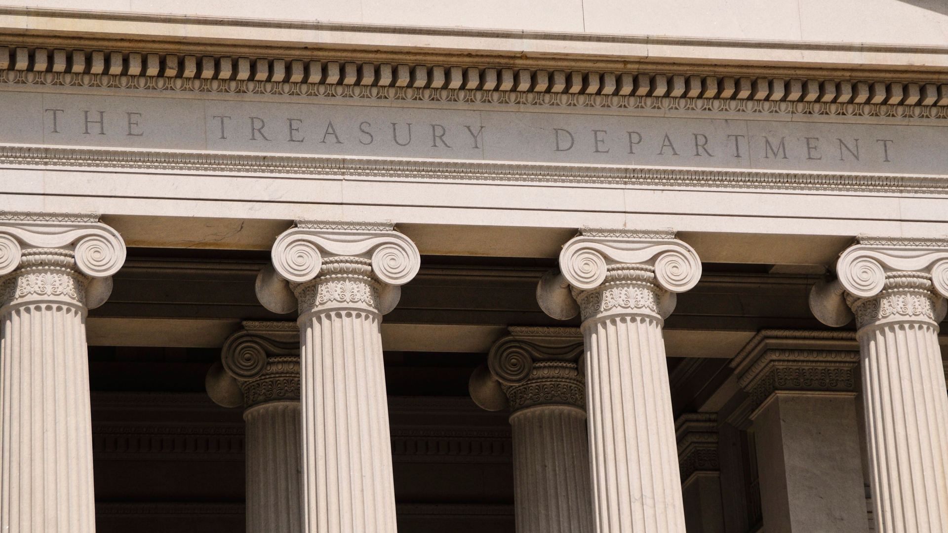 The grand stone columns of "The Treasury Department," adorned with intricate capitals, reflect classical architecture. Whispers of a sovereign wealth fund echo through these historic halls, hinting at financial strategies reminiscent of empires past.